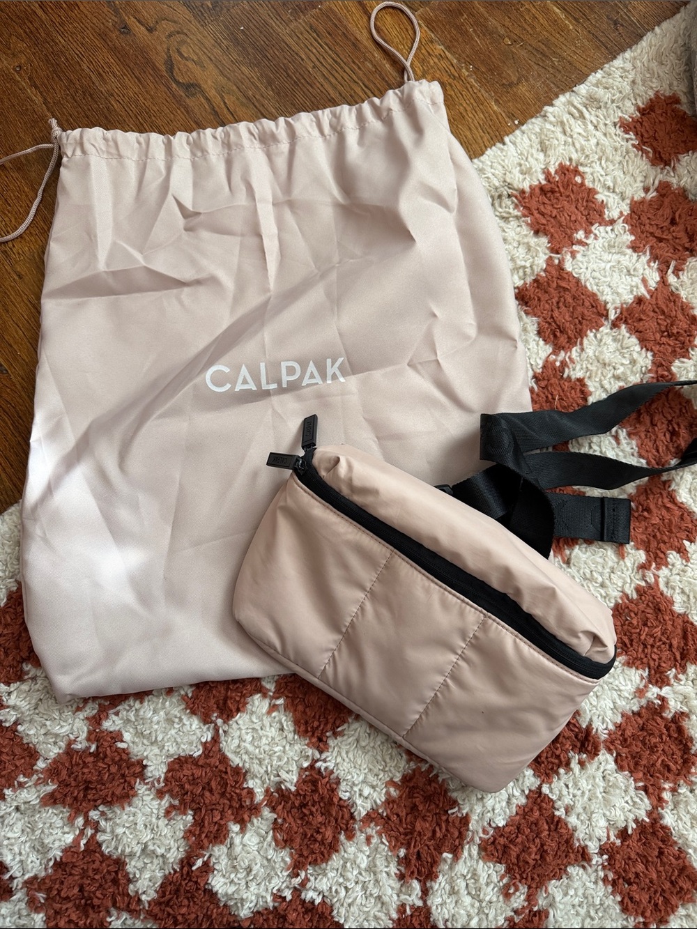 Calpak Blush Pink Crossbody Belt Bag with Black Strap